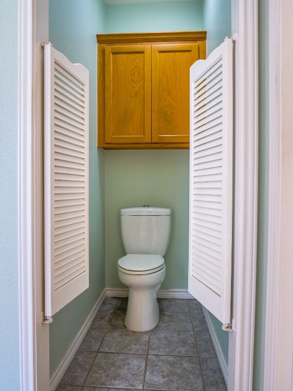 bathroom featuring tile patterned floors and toilet