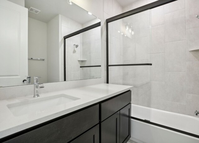 151 William Hersee Dr, Bastrop, TX 78602 - bathroom with vanity and combined bath / shower with glass door