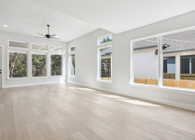 151 William Hersee Dr, Bastrop, TX 78602 - unfurnished living room with ceiling fan, baseboards, light wood-style flooring, and recessed lighting