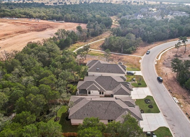 151 William Hersee Dr, Bastrop, TX 78602 - aerial view of property and surrounding area with a heavily wooded area