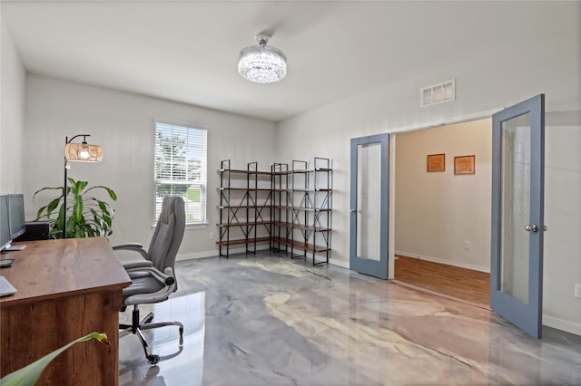 office featuring concrete flooring and french doors