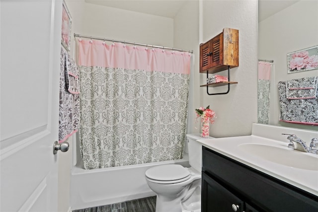 full bathroom featuring shower / bathtub combination with curtain, vanity, and toilet