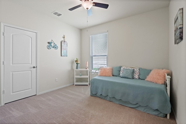 carpeted bedroom with ceiling fan