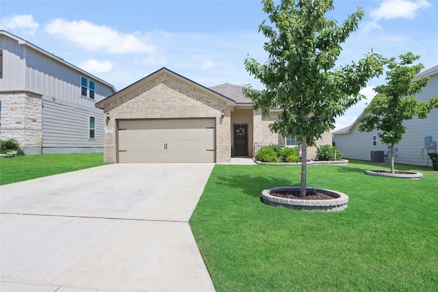 view of front of house featuring central air condition unit, a front yard, and a garage