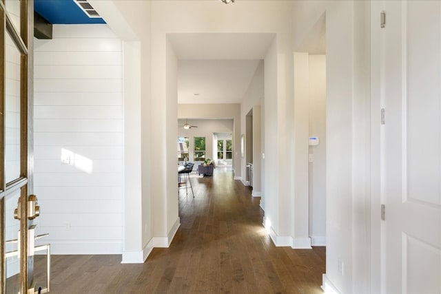 corridor with dark wood-type flooring