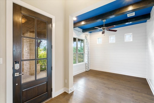 foyer featuring ceiling fan, beam ceiling, and dark wood-type flooring