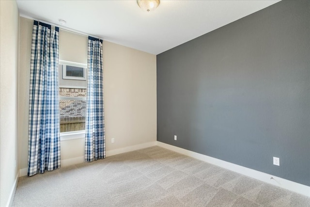 empty room featuring carpet flooring