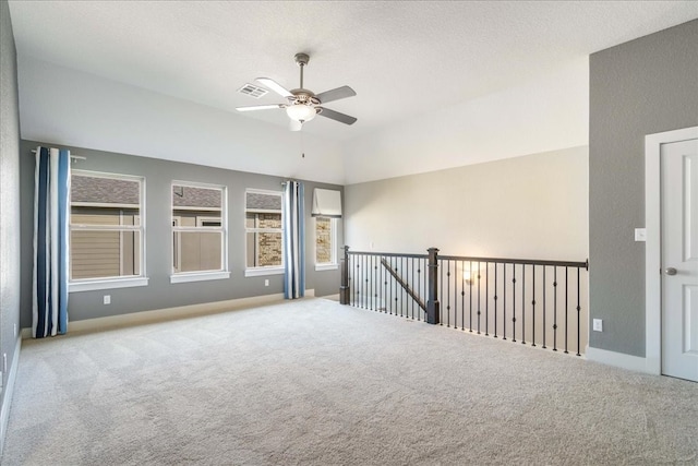 spare room featuring carpet flooring and ceiling fan