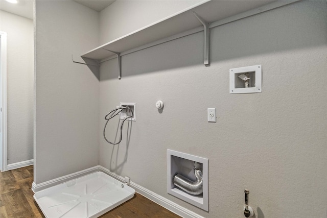 washroom with hookup for a gas dryer, hookup for a washing machine, and dark wood-type flooring