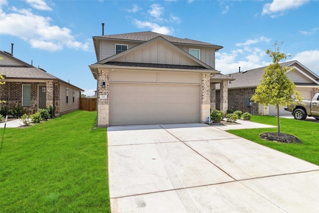 view of front of home featuring a garage and a front yard