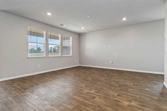 spare room featuring hardwood / wood-style floors