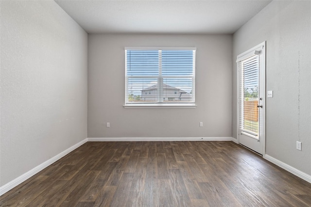 unfurnished room featuring dark hardwood / wood-style floors