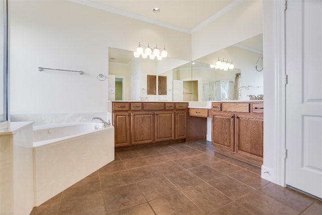 bathroom with vanity, crown molding, tile patterned flooring, and a bathtub