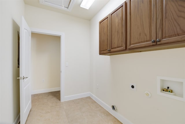 laundry room featuring light tile patterned flooring, hookup for an electric dryer, gas dryer hookup, hookup for a washing machine, and cabinets