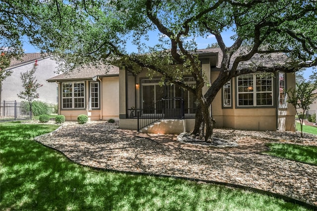 back of house featuring a yard