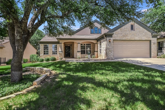 view of front facade featuring a garage and a front yard