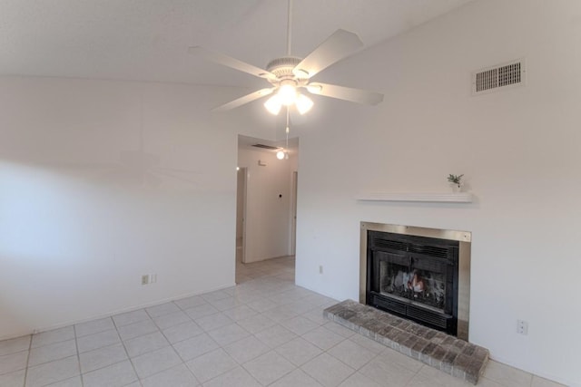 unfurnished living room with lofted ceiling, light tile patterned floors, and ceiling fan