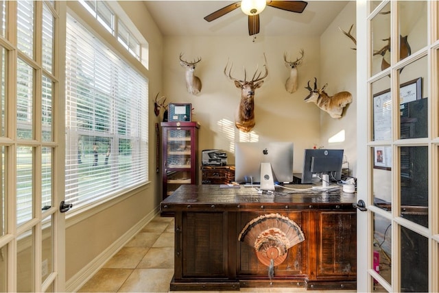 tiled office featuring a wealth of natural light, french doors, and ceiling fan