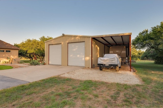 garage with a lawn and a carport