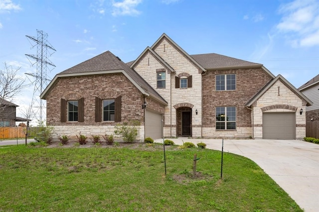 view of front of home featuring a garage and a front yard