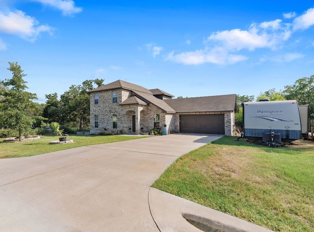 view of front of property with a garage and a front yard