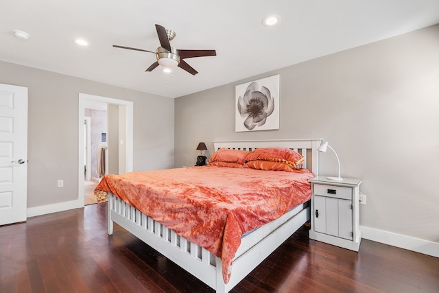 bedroom with dark hardwood / wood-style floors and ceiling fan