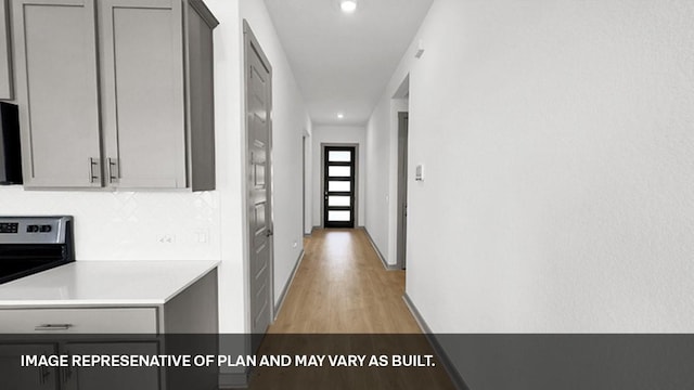 hallway featuring light wood-type flooring