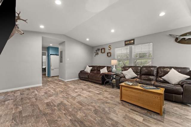 living room featuring hardwood / wood-style flooring and lofted ceiling