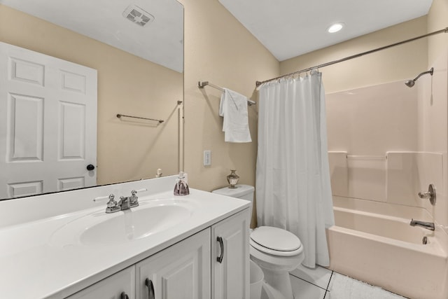 full bathroom with tile patterned flooring, shower / bath combo with shower curtain, toilet, and vanity