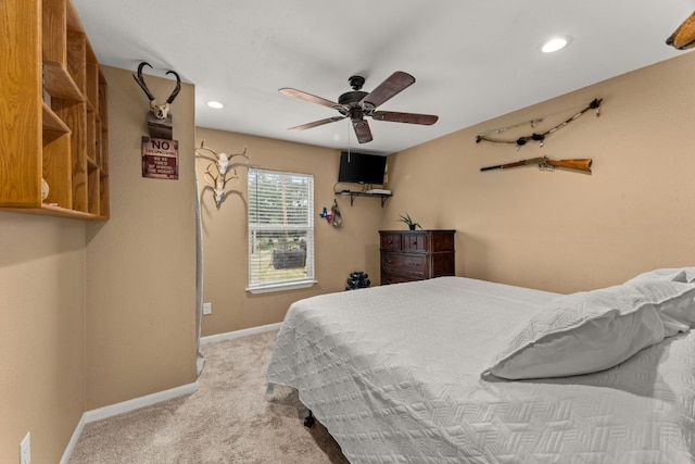 bedroom with light carpet and ceiling fan