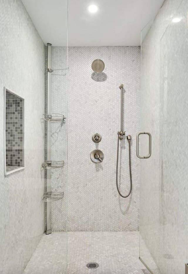 bathroom with a tile shower