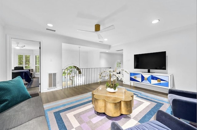 living room with hardwood / wood-style flooring and ceiling fan