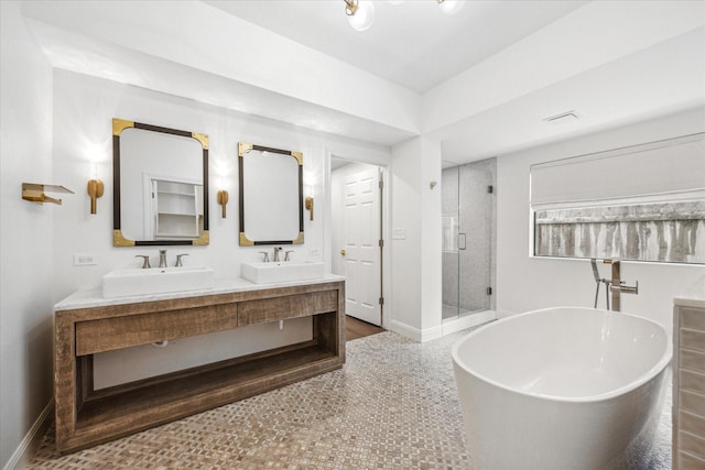 bathroom featuring plus walk in shower and vanity