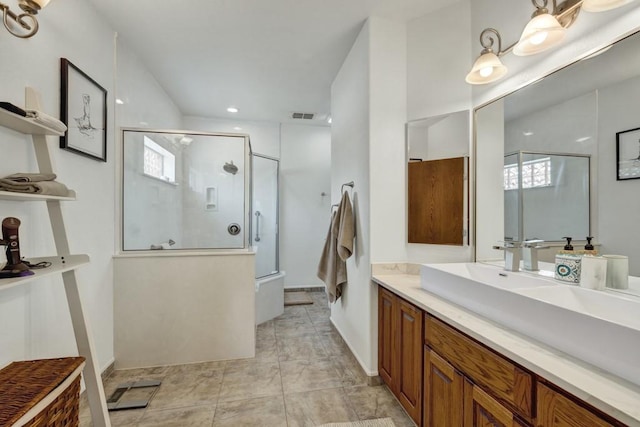 full bath with visible vents, an enclosed shower, and vanity