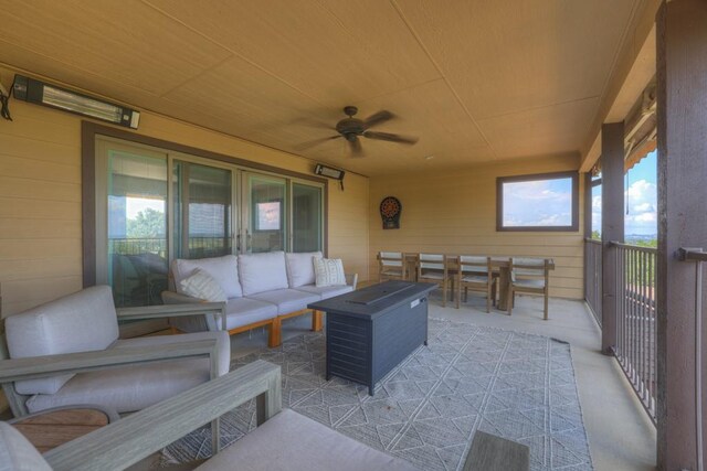 view of patio with outdoor lounge area, ceiling fan, and a balcony