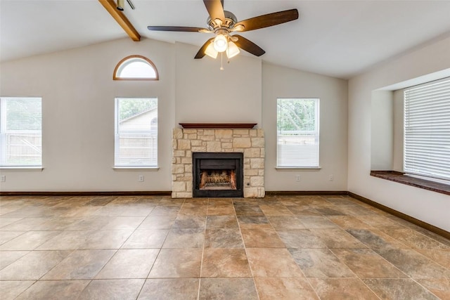 unfurnished living room with vaulted ceiling with beams, a fireplace, and ceiling fan