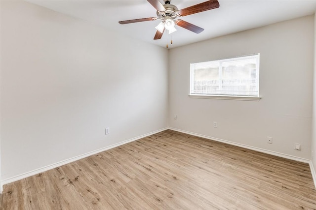 empty room featuring ceiling fan and light hardwood / wood-style floors