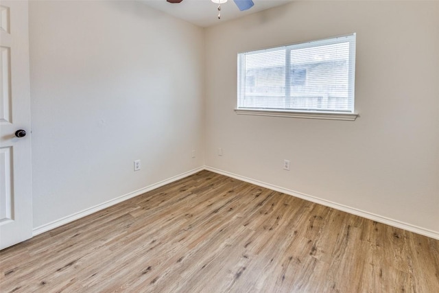 empty room with ceiling fan and light hardwood / wood-style floors