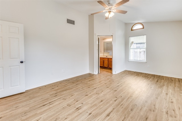 spare room with high vaulted ceiling, light wood-type flooring, and ceiling fan