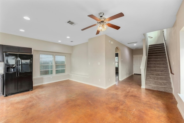 unfurnished living room with ceiling fan