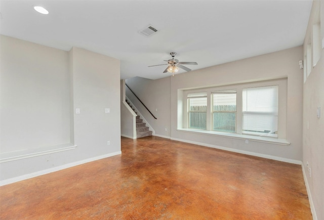 empty room featuring concrete flooring and ceiling fan