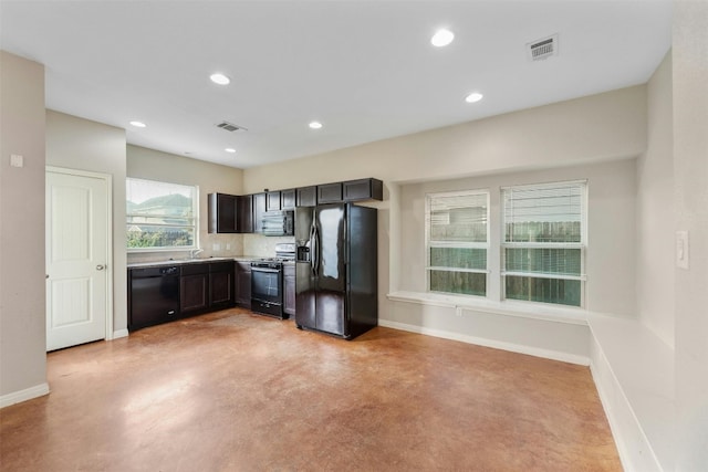 kitchen featuring tasteful backsplash, sink, black appliances, and dark brown cabinetry