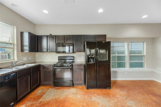 kitchen featuring sink, decorative backsplash, dark brown cabinetry, and black appliances