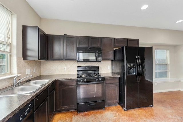 kitchen featuring a wealth of natural light, sink, dark brown cabinets, and black appliances