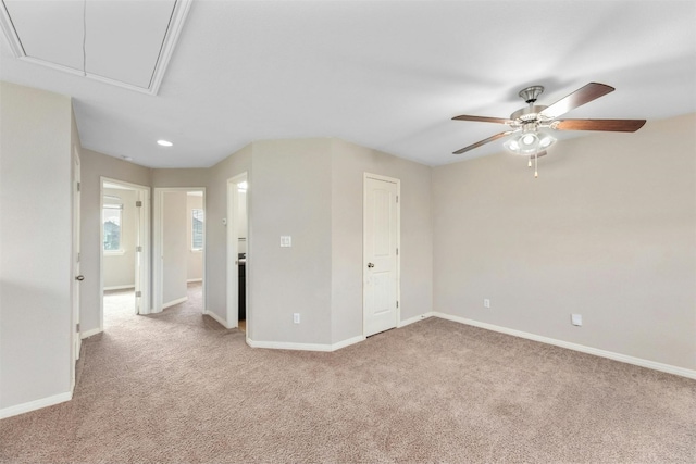 unfurnished bedroom featuring light carpet and ceiling fan