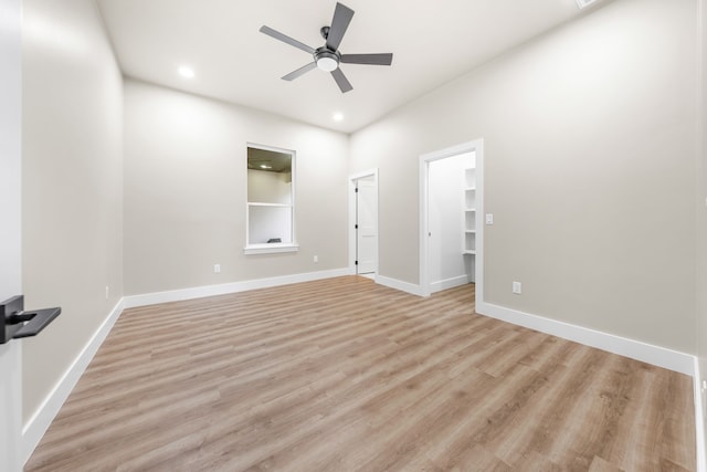 spare room featuring ceiling fan and light wood-type flooring