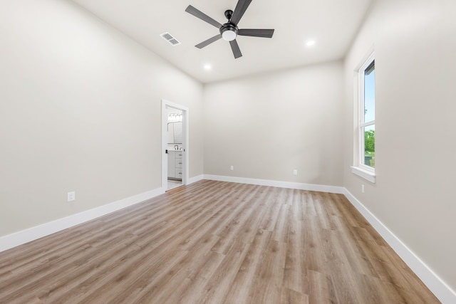 unfurnished room featuring ceiling fan and light wood-type flooring