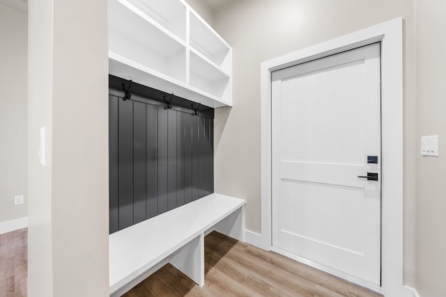 mudroom with light hardwood / wood-style floors