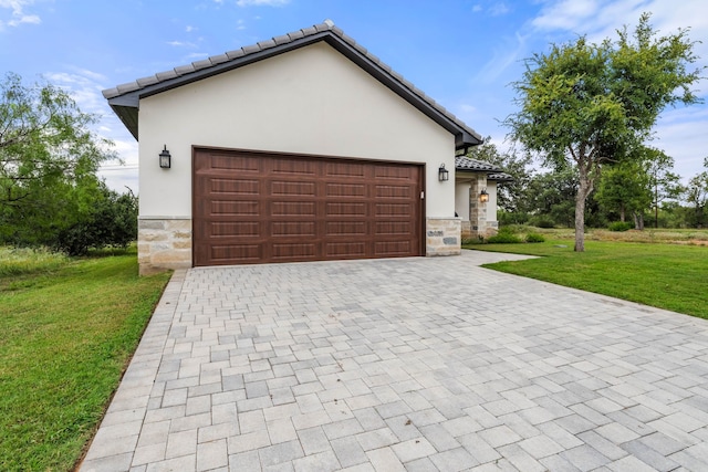 view of front of house with a garage and a front yard