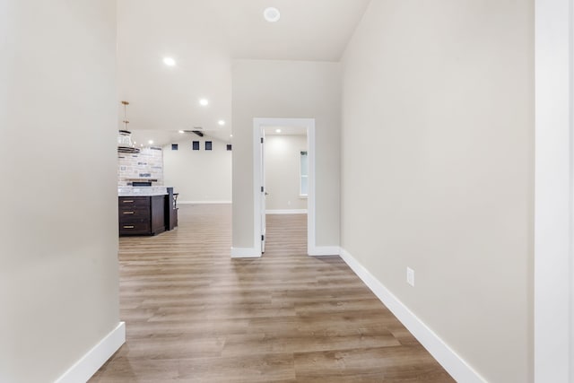 hallway with light wood-type flooring